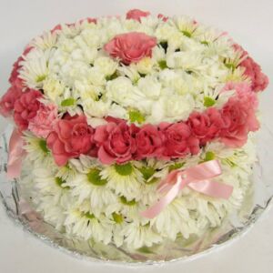 White flower cake with pink details