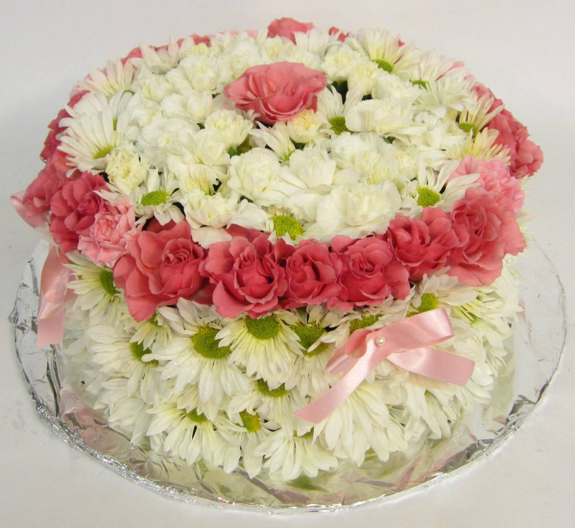 White flower cake with pink details